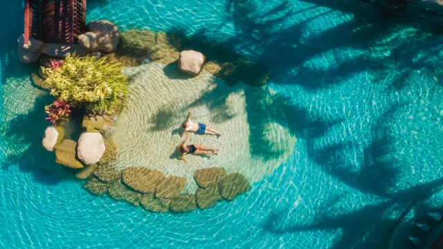 Couple enjoying hot springs pool in Borinquen Mountain Resort
