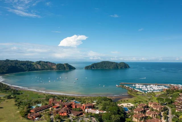 Expansive views of the bay, marina, and rainforest in Los Sueños