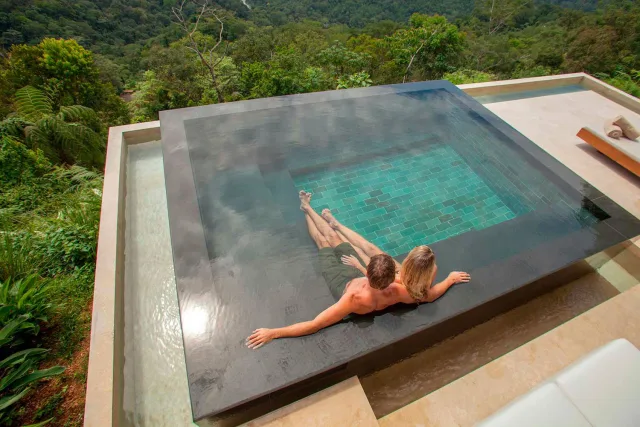 Couple overlooking the rainforest from a private plunge pool